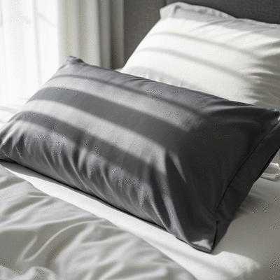 Luxurious silk pillowcase with a soft, smooth texture on a bed
